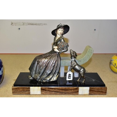 AN ART DECO SPELTER MARBLE AND CHRYSELEPHANTINE EFFECT FIGUR...