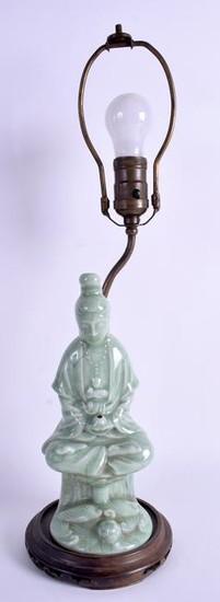 AN EARLY 20TH CENTURY CHINESE CELADON POTTERY FIGURE OF