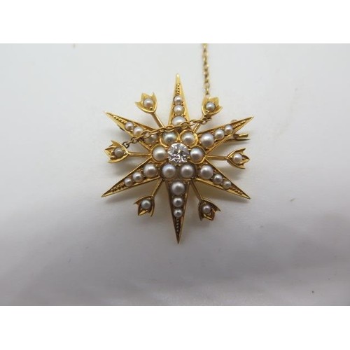 An 18ct gold diamond and seed pearl star shape brooch, the c...