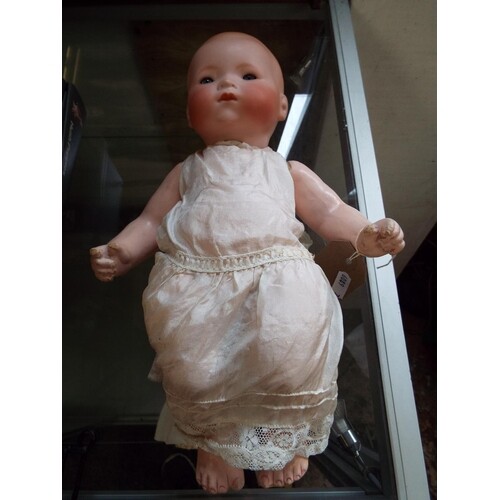 An Armand Marseille 341/4K bisque doll with sleepy eyes