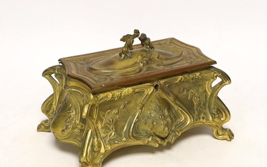 An Art Nouveau gilt metal jewellery casket with padded linin...
