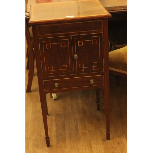 An Edwardian inlaid mahogany pot cupboard, adapted from a wi...