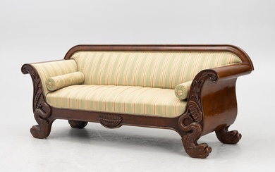 An Empire sofa, first half of the 19th century.