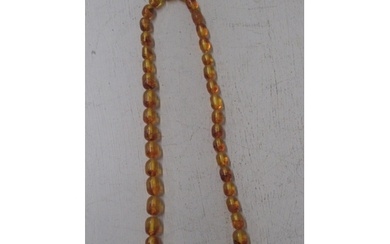 An amber bead necklace, 42cm, graduated barrel shaped beads ...