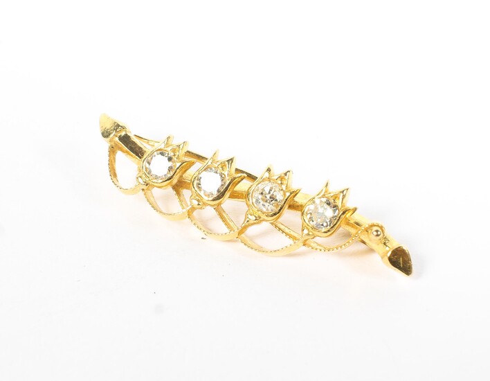 An early 20th century Continental unmarked yellow metal and diamond bar brooch with four flower