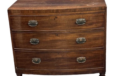 An early 20th century mahogany bowfront chest of three long...