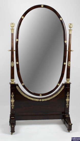 An early 20th century mahogany ormolu mounted French Empire style cheval mirror.