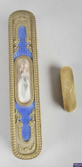An early 20th century miniature hairbrush, the oval gold panelled back decorated with a small diamond, together with a gilt metal and blue enamelled backed ladies' dressing table brush.
