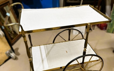 An early to mid 20th century cocktail trolley with glass she...