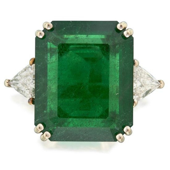 An emerald, diamond, and fourteen karat white gold