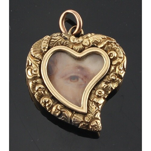 An unmarked yellow gold heart shaped pendant set with a mini...