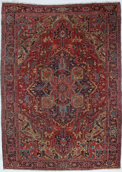 NOT SOLD. An antique Heriz carpet, North West Persia. Classical medallion design. Early 20th century....