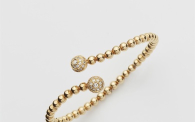 Bracelet croisé avec diamants Or jaune 18 cts. Cercle ouvert flexible en forme de boule,...