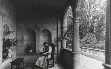 British School, late 19th/early 20th century- A young woman reading in the loggia at Cranborne Manor, c.1901; gelatin silver print, 28x34cm Note: This photograph was published in Country Life, 1901 issue 257 pg 732 Provenance: Property of Future...