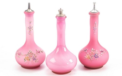 Collection of three antique Barber Bottles, pink satin glass, two with hand painted flowers. Two