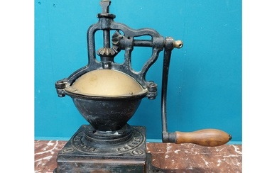 Early 20th C. cast iron coffee grinder. {36 cm H x 36 cm W ...