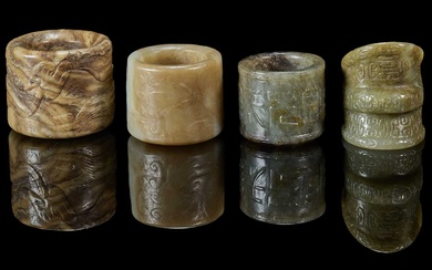 FOUR CARVED JADE ARCHERS RINGS, QING DYNASTY, 19TH CENTURY