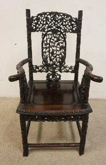 HEAVILY CARVED ASIAN HARDWOOD ARM CHAIR