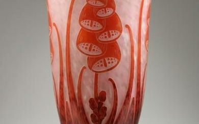 LA VOIE FRANCAISE A TALL GLASS VASE with foxgloves in