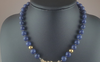 Lapis necklace with shell pendant.
