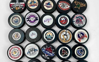 Large Collection of NHL Hockey Pucks