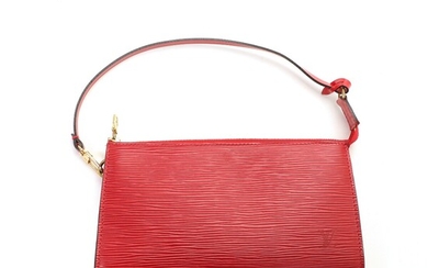 SOLD. Louis Vuitton: A "Accessory Pouch" made of red epi leather with gold toned hardware,...