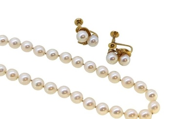 Mikimoto - A single row pearl necklace, together with a pair of ear studs