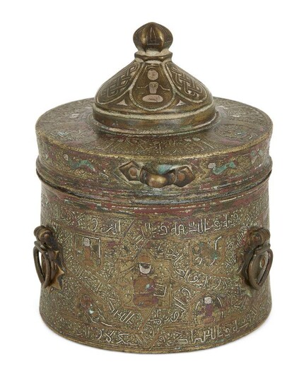Property from an Important Private Collection A silver and copper inlaid bronze inkwell and associated cover, Khorasan, Iran, 13th century, of squat cylindrical form, the cover with three suspension loops, a flattened shoulder, central dome and...