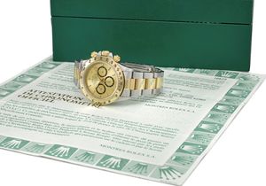 ROLEX. A FINE STAINLESS STEEL AND 18K GOLD AUTOMATIC CHRONOGRAPH WRISTWATCH WITH CHAMPAGNE DIAL, BRACELET AND BOX, SIGNED ROLEX, OYSTER PERPETUAL, COSMOGRAPH, DAYTONA, REF. 16523, CASE NO. U132707, CIRCA 1999