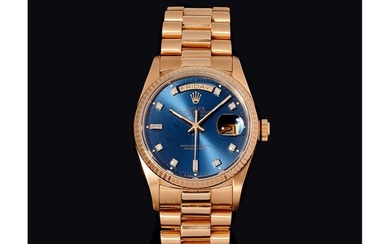 Rolex Day-Date, Réf. 18038, n°9748xxx, vers 1988. Une belle montre en or, cadran bleu rayonnant,...
