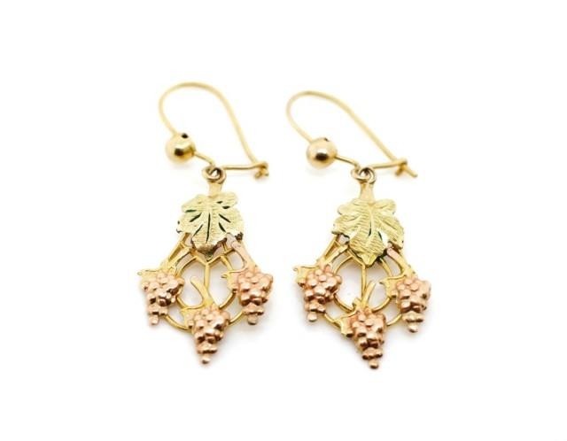 Rose and yellow gold earrings in a vine and leaf cast patter...