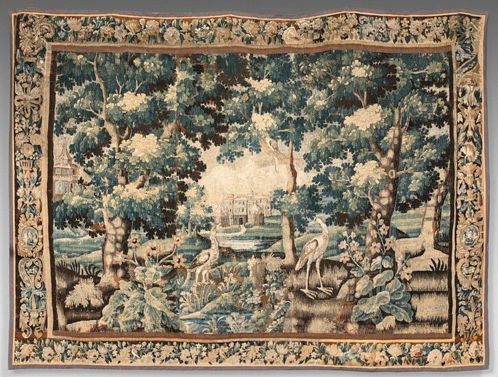 Tapestry in wool and silk decorated with birds in a clearing on a background of factories. Border of flowers, vases and ribbon knots.