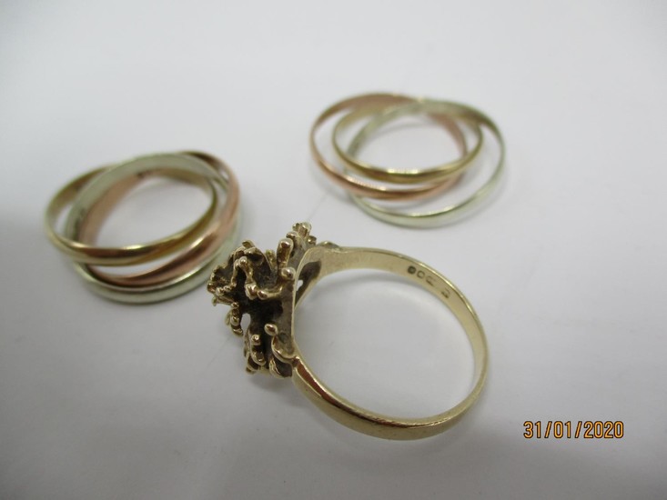 Two 9ct gold Russian tri-coloured rings and a 9ct gold flowe...