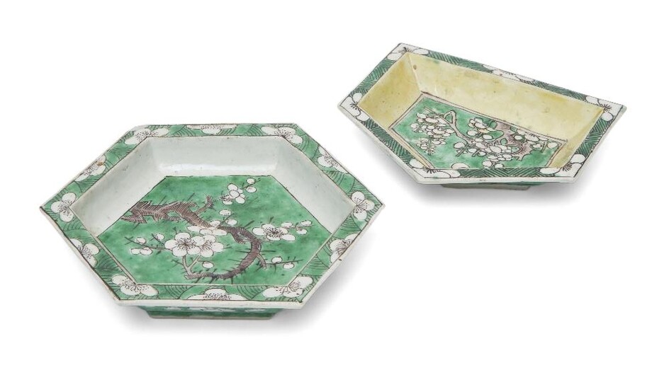 Two Chinese biscuit porcelain sancai sweetmeat dishes, Kangxi period, one hexagonal painted with prunus to the centre over a green ground, the pentagonal dish decorated with similar subject with yellow glaze applied to the interior, 14cm wide. (2)...