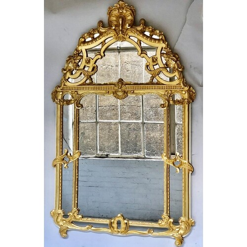 WALL MIRROR, mid 18th century style French carved giltwood w...