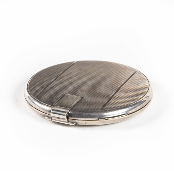An Elegant Art Deco Silver and Parcel Gilt Compact