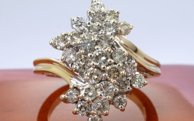 14 kt. Gold - 1.50Ct -entourage diamond ring with 27 stones.