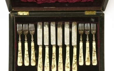 A set of twelve Japanese ivory and Shibayama fruit knives and forks, each handle decorated with ...