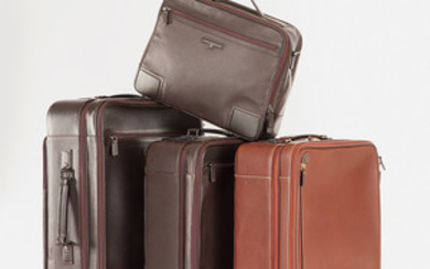 A. Testoni Three suitcases and one kit in brown leather...