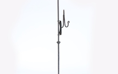 A 19th century wrought iron adjustable standing rushnip hold...