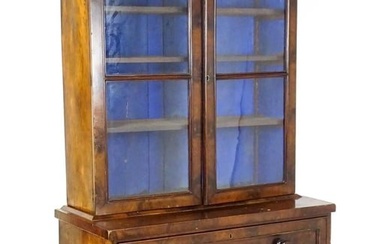 A 19thC mahogany secretaire bookcase with a moulded top above to glazed doors and three adjustable