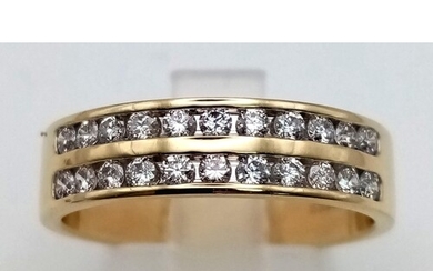 A 9K yellow gold ring with two diamond (0.50 carats) bands o...