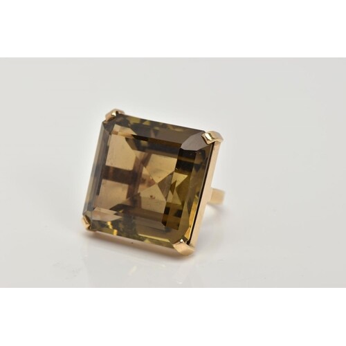 A 9CT GOLD, LARGE SMOKEY QUARTZ DRESS RING, designed with a ...