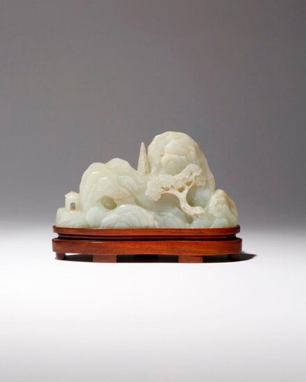 A CHINESE CELADON JADE 'MOUNTAIN' CARVING QIANLONG 1736-95 Formed as...