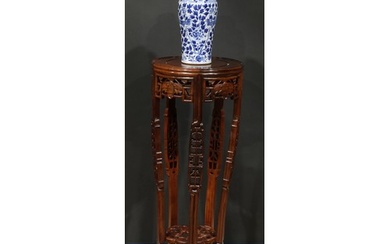 A Chinese hardwood jardiniere stand, pierced and carved with...