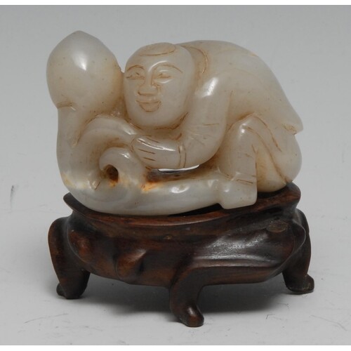 A Chinese pale jade carving, of a boy grasping a peach, 7cm ...