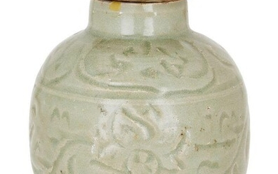 A Chinese stoneware celadon ovoid jar and cover, 15th century, incised with a central band of flowering lotus scrolls, 12.5cm high