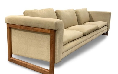 A Dux-style upholstered sofa