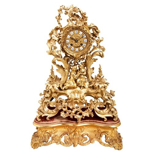 A FRENCH EARLY 19TH CENTURY ORNATE BRASS MANTEL CLOCK, the b...