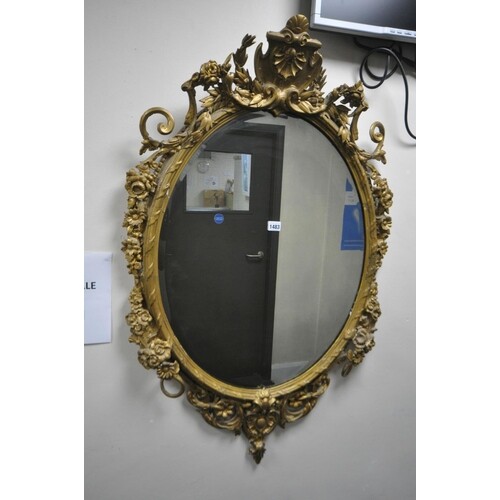A GILTWOOD LOUIS XVI FRENCH STYLE WALL MIRROR, having a late...